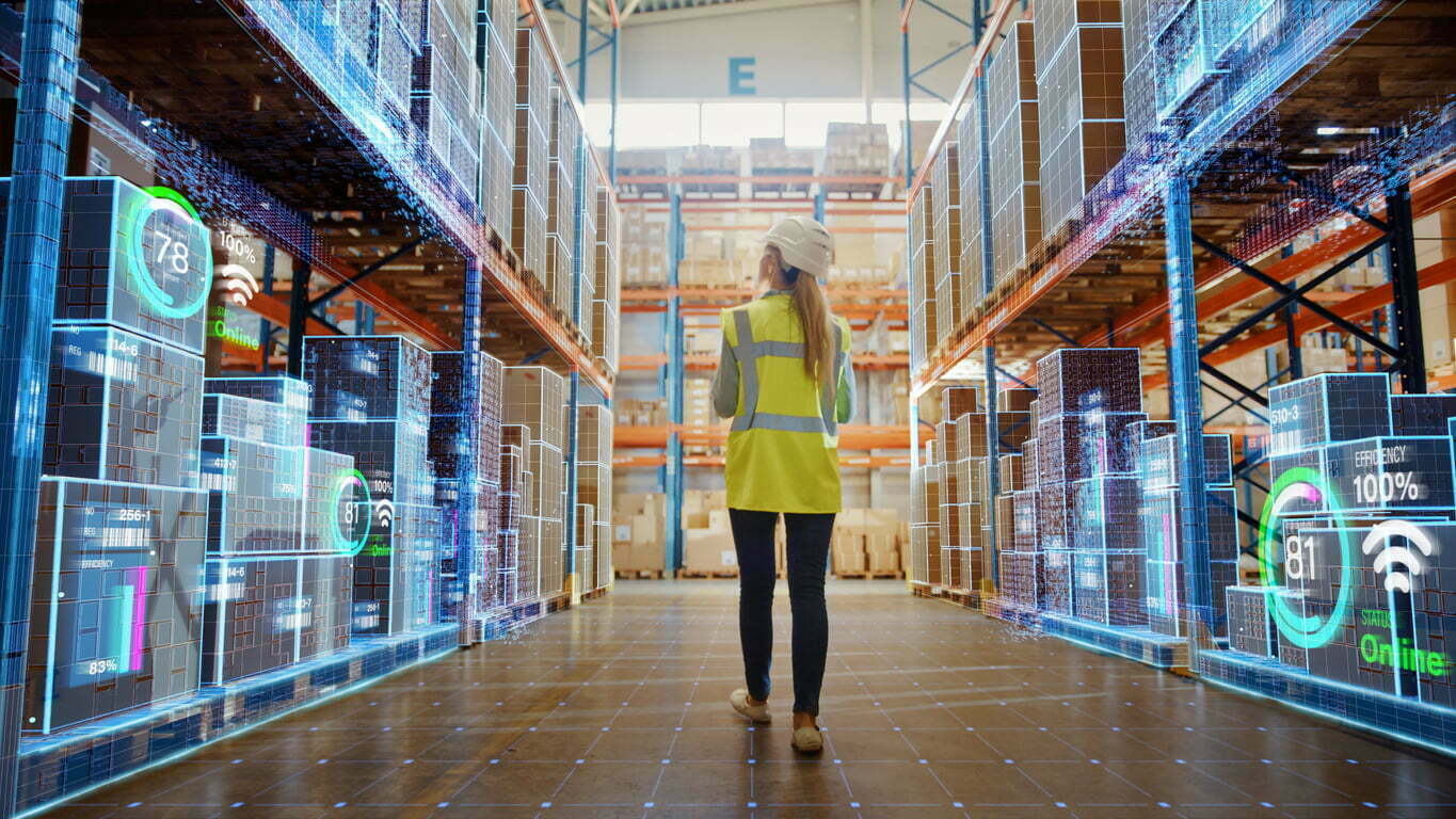 data-warehouses-zeenea-article Futuristic Technology Retail Warehouse: Worker Doing Inventory Walks When Digitalization Process Analyzes Goods, Cardboard Boxes, Products With Delivery Infographics In Logistics, Distribution Center